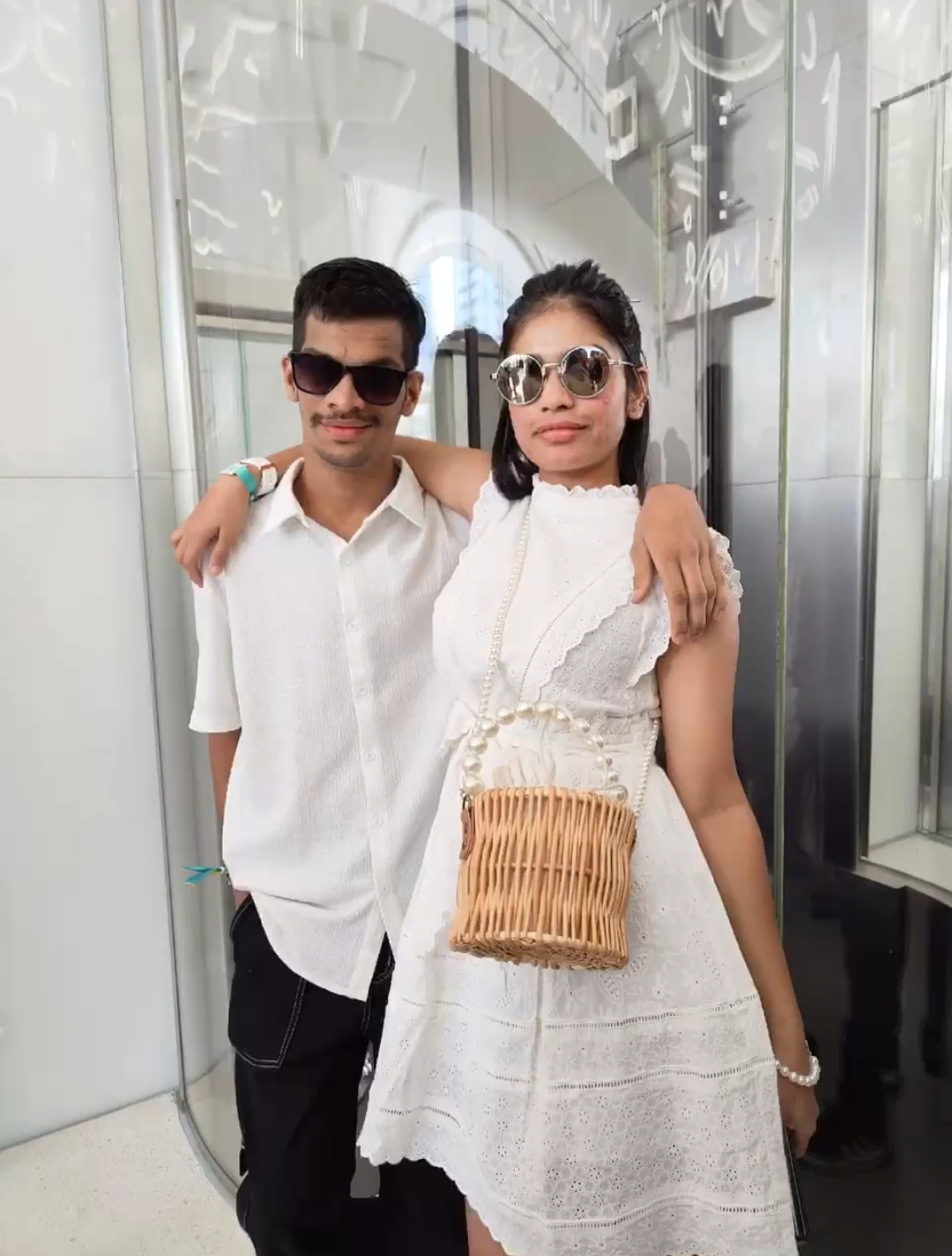 Brother and sister together in white outfits